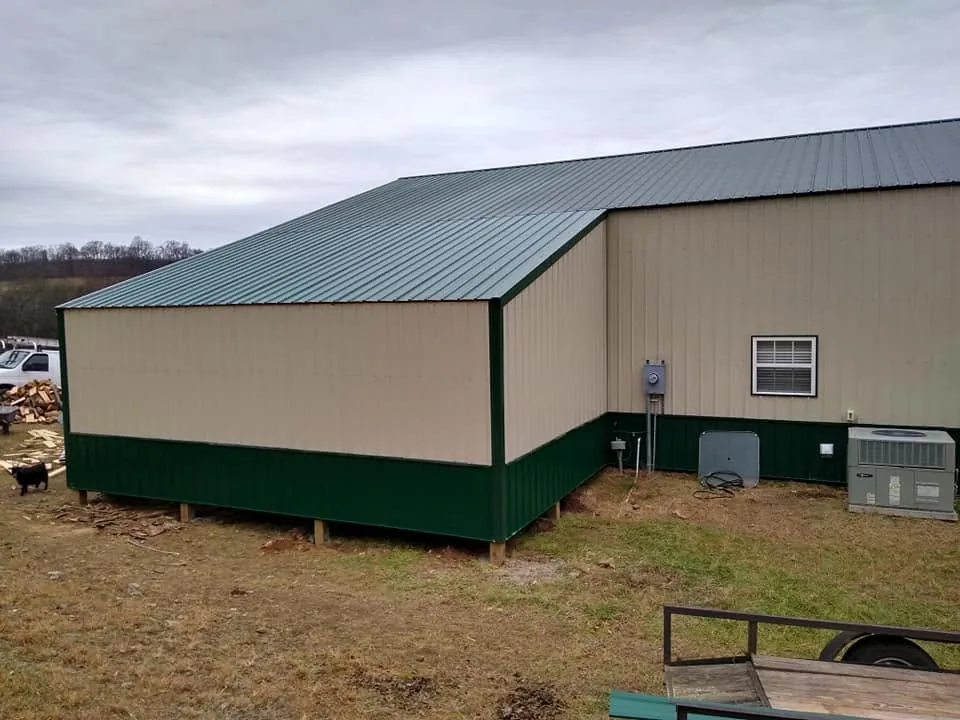 Green metal roof on a new shop building built by Mote's Construction in Maury County
