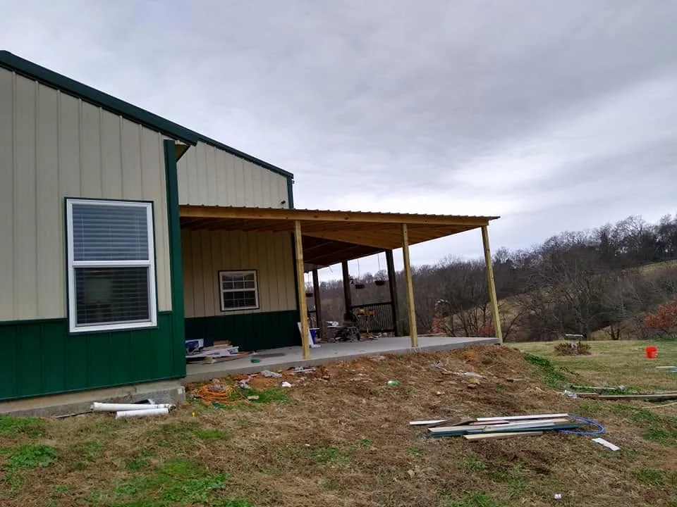 Shop building with metal roof and covered porch built by Mote's Construction