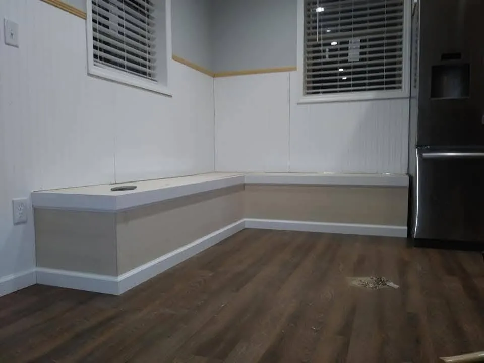 Built-in L-shaped corner bench with wainscot paneling, Mote's Construction